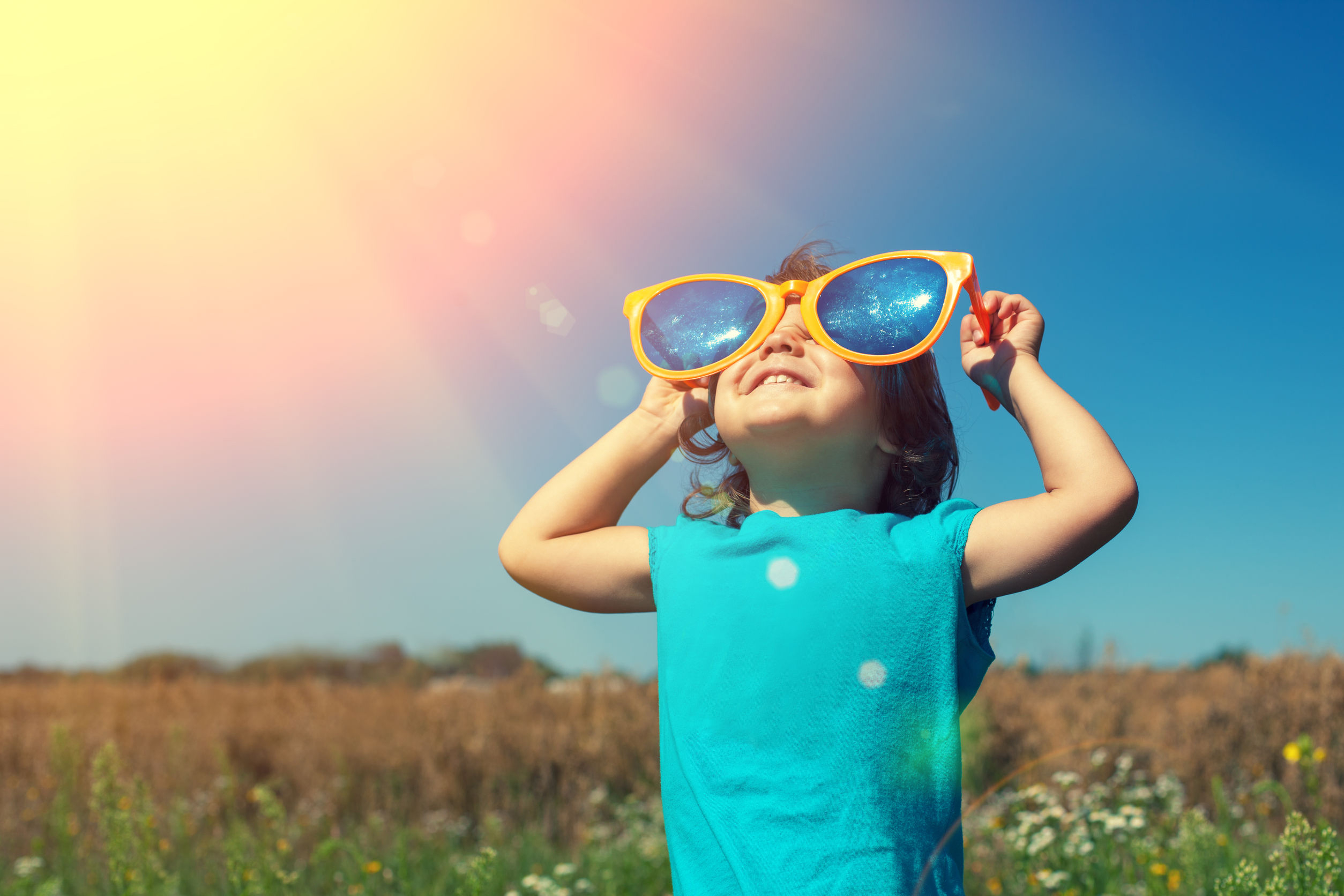 40361353 - little girl with big sunglasses enjoys sun